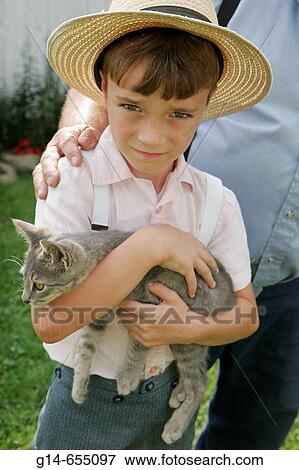 Amish Farm Tour, boy, kitten, straw hat. Shipshewana. Indiana. USA. View Large Photo Image Stock Photo - Amish Farm Tour, boy, kitten, straw hat. Shipshewana. Indiana. USA.. Fotosearch