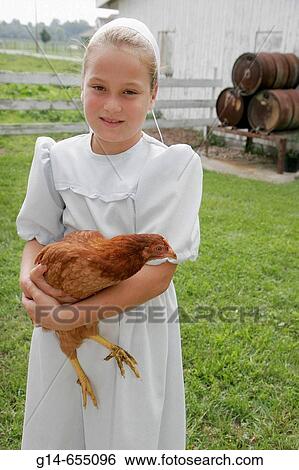 Amish Farm Tour, girl, chicken. Shipshewana. Indiana. USA. View Large Photo Image Stock Photograph - Amish Farm Tour, girl, chicken. Shipshewana. Indiana. USA.. Fotosearch