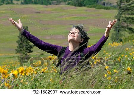 Stock Photo - Among flowers. Fotosearch