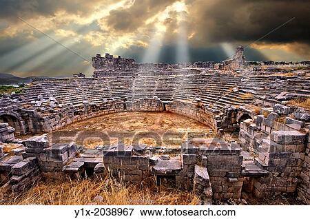 Stock Photo - Ampitheatre of Xanthos that has been modified by the Romans with a wall around what would have been the stage to make a pit for Gladitorial & animal events. Xanthos UNESCO World Heritage Archaeological Site, Turkey.. Fotosearch