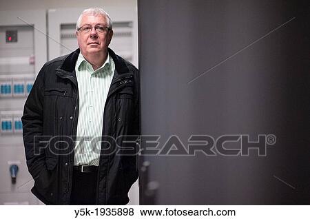 Amsterdam, Netherlands. Portrait of a man at a datacentre for internet traffic. View Large Photo Image Stock Photo - Amsterdam, Netherlands. Portrait of a man at a datacentre for internet traffic.. Fotosearch