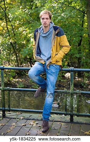 Amsterdam, Netherlands. Young man in his twenties, diagnosed with ADD or Attention Deficit Disorder. He works several jobs and considers to make a documentary with his journalist girlfriend. View Large Photo Image Stock Photography - Amsterdam, Netherlands. Young man in his twenties, diagnosed with ADD or Attention Deficit Disorder. He works several jobs and considers to make a documentary with his journalist girlfriend.. Fotosearch