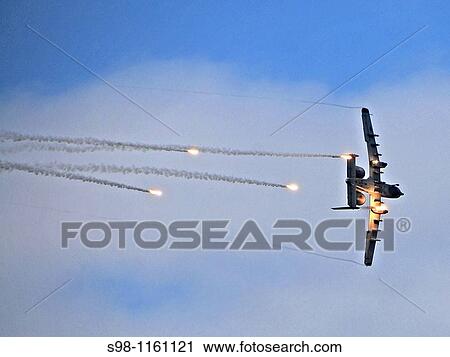 An A-10 Thunderbolt II fires flares as part of a combat search and rescue scenario Oct 7 during Airpower Day at Osan Air Base, South Korea Air shows improve base morale and friendships with local citizens View Large Photo Image Stock Image - An A-10 Thunderbolt II fires flares as part of a combat search and rescue scenario Oct 7 during Airpower Day at Osan Air Base, South Korea Air shows improve base morale and friendships with local citizens. Fotosearch