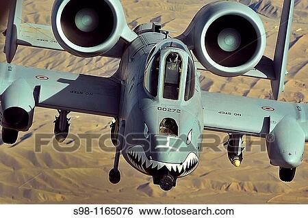 An A-10 Thunderbolt II flies a close-air-support mission over Afghanistan on Oct 7 View Large Photo Image Stock Photograph - An A-10 Thunderbolt II flies a close-air-support mission over Afghanistan on Oct 7. Fotosearch