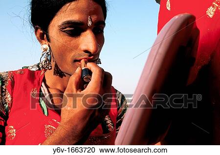 Stock Image - An actor is making up as a woman in Rajasthan, India. Fotosearch