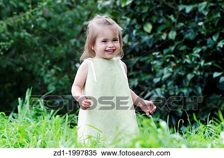 An adorable girl plays and smiles during a summer vacation. View Large Photo Image Stock Photography - An adorable girl plays and smiles during a summer vacation.. Fotosearch