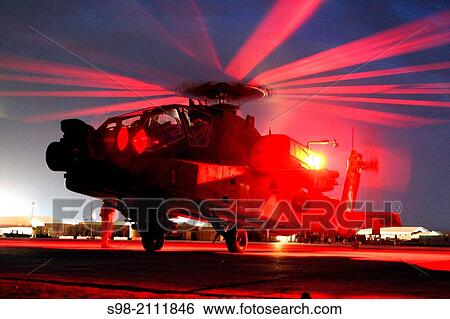 An AH-64D Apache Longbow helicopter gunship from the 1st Attack Reconnaissance Battalion, 1st Aviation Regiment, prepares for a night mission on May 31. View Large Photo Image Stock Photograph - An AH-64D Apache Longbow helicopter gunship from the 1st Attack Reconnaissance Battalion, 1st Aviation Regiment, prepares for a night mission on May 31.. Fotosearch