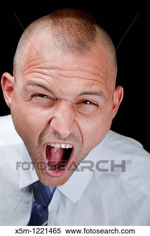 Stock Photography - An angry businessman with a Mohican haircut. Fotosearch