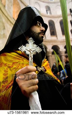 An Armenian priest during a? Palm Sunday? ceremony inside the church of the holy Sepulchre View Large Photo Image Stock Image - An Armenian priest during a? Palm Sunday? ceremony inside the church of the holy Sepulchre. Fotosearch