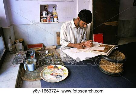An artist is painting a miniature in India View Large Photo Image Picture - An artist is painting a miniature in India. Fotosearch