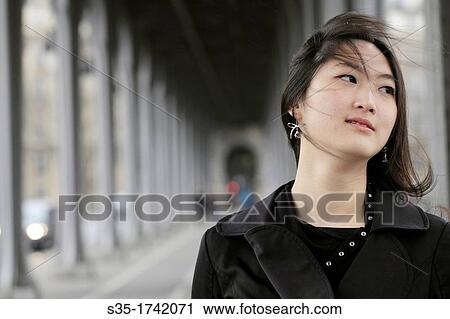 An asian girl in the pedestrians level of Pont Bir-Hakeim, Paris, France View Large Photo Image Stock Image - An asian girl in the pedestrians level of Pont Bir-Hakeim, Paris, France. Fotosearch
