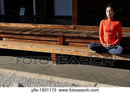 An asian woman meditates in the courtyard of the Garden of Solitary Sitting at the Zuiho-in, a sub-temple of the Daitokuji Monastery in Kyoto Japan View Large Photo Image Stock Image - An asian woman meditates in the courtyard of the Garden of Solitary Sitting at the Zuiho-in, a sub-temple of the Daitokuji Monastery in Kyoto Japan. Fotosearch