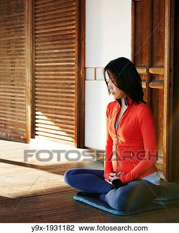 An asian woman meditates in the courtyard of the Garden of Solitary Sitting at the Zuiho-in, a sub-temple of the Daitokuji Monastery in Kyoto Japan View Large Photo Image Stock Image - An asian woman meditates in the courtyard of the Garden of Solitary Sitting at the Zuiho-in, a sub-temple of the Daitokuji Monastery in Kyoto Japan. Fotosearch