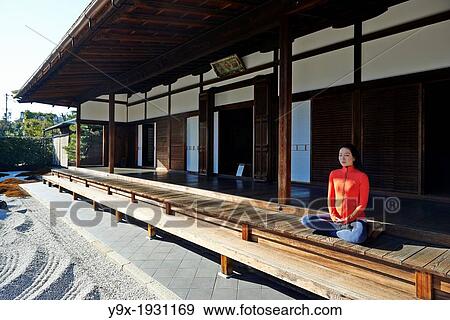 An asian woman meditates in the courtyard of the Garden of Solitary Sitting at the Zuiho-in, a sub-temple of the Daitokuji Monastery in Kyoto Japan View Large Photo Image Stock Photo - An asian woman meditates in the courtyard of the Garden of Solitary Sitting at the Zuiho-in, a sub-temple of the Daitokuji Monastery in Kyoto Japan. Fotosearch