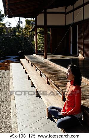 An asian woman meditates in the courtyard of the Garden of Solitary Sitting at the Zuiho-in, a sub-temple of the Daitokuji Monastery in Kyoto Japan View Large Photo Image Stock Photography - An asian woman meditates in the courtyard of the Garden of Solitary Sitting at the Zuiho-in, a sub-temple of the Daitokuji Monastery in Kyoto Japan. Fotosearch