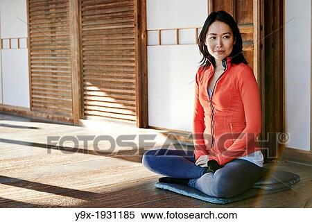 An asian woman meditates in the courtyard of the Garden of Solitary Sitting at the Zuiho-in, a sub-temple of the Daitokuji Monastery in Kyoto Japan View Large Photo Image Stock Photography - An asian woman meditates in the courtyard of the Garden of Solitary Sitting at the Zuiho-in, a sub-temple of the Daitokuji Monastery in Kyoto Japan. Fotosearch