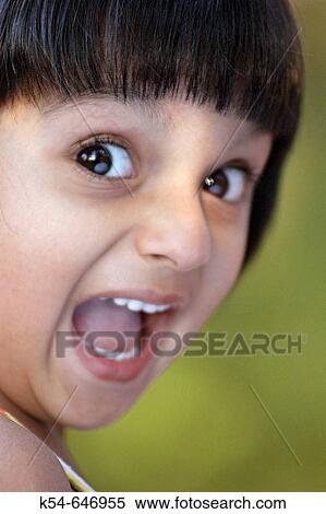 An astonished face close-up of a girl. View Large Photo Image Stock Photography - An astonished face close-up of a girl.. Fotosearch
