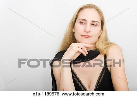 An attractive American woman with beautiful long, flowing blond hair, posing with black scarf, looking off camera View Large Photo Image Stock Photograph - An attractive American woman with beautiful long, flowing blond hair, posing with black scarf, looking off camera. Fotosearch