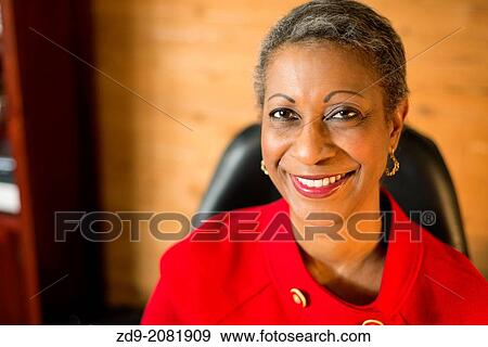 Stock Photo - An attractive middle-aged professional black woman.. Fotosearch