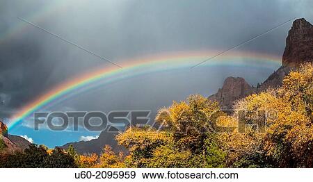 An autumn shower produces a rainbow in Zion Canyon at Zion National Park, Utah. View Large Photo Image Stock Photo - An autumn shower produces a rainbow in Zion Canyon at Zion National Park, Utah.. Fotosearch