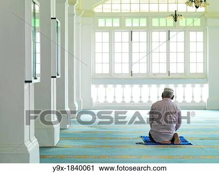 An elder man praying in a mosque View Large Photo Image Stock Image - An elder man praying in a mosque. Fotosearch