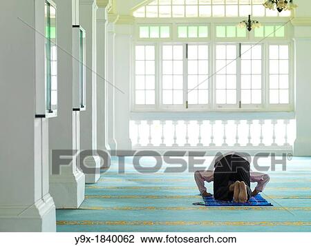 An elder man praying in a mosque View Large Photo Image Stock Image - An elder man praying in a mosque. Fotosearch