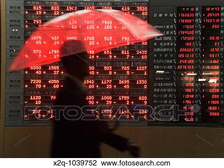 Stock Image - An electronic board with the stock market prices of the Tokyo Stock Exchangel Tokyo Japan. Fotosearch