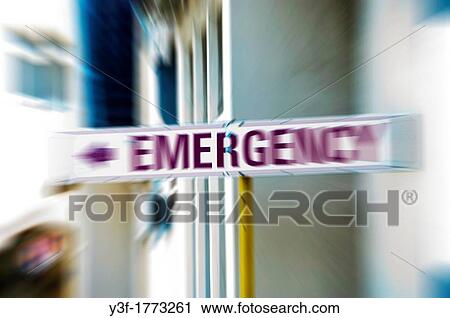 Stock Image - An emergency directional sign at a hospital with zoom effetc. Fotosearch