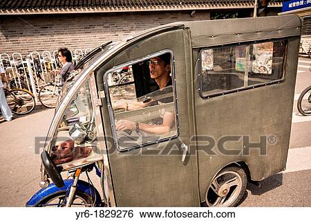 An enclosed scooter during summer in Beijing, China View Large Photo Image Stock Photograph - An enclosed scooter during summer in Beijing, China. Fotosearch