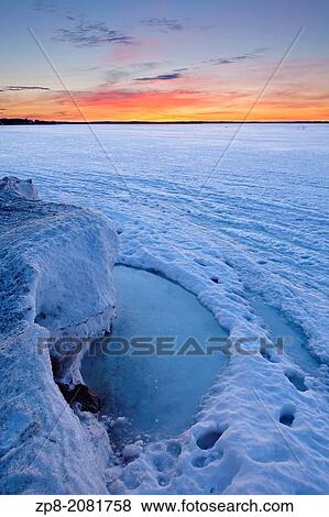 An evolving landscape of thawing and shifting ice graces Lake Simcoe in the early spring warmth. Georgina, Ontario, Canada. View Large Photo Image Stock Photo - An evolving landscape of thawing and shifting ice graces Lake Simcoe in the early spring warmth. Georgina, Ontario, Canada.. Fotosearch