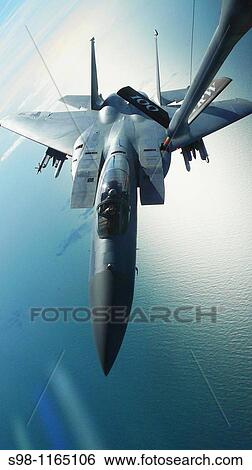 Stock Photograph - An F-15 Eagle receives fuel March 18 from a KC-135 Stratotanker during a refueling mission The F-15 is assigned to the 48th Fighter Wing at Royal Air Force Lakenheath, England, and the KC-135 is assigned to RAF Mildenhall, England. Fotosearch