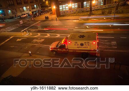 An FDNY ambulance is parked outside an apartment building as the EMT? s visit a patient in the Chelsea neighborhood of New York View Large Photo Image Stock Image - An FDNY ambulance is parked outside an apartment building as the EMT? s visit a patient in the Chelsea neighborhood of New York. Fotosearch