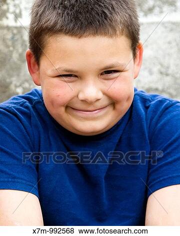 An hispanic/latin little boy with a nervous smile View Large Photo Image Stock Photo - An hispanic/latin little boy with a nervous smile. Fotosearch