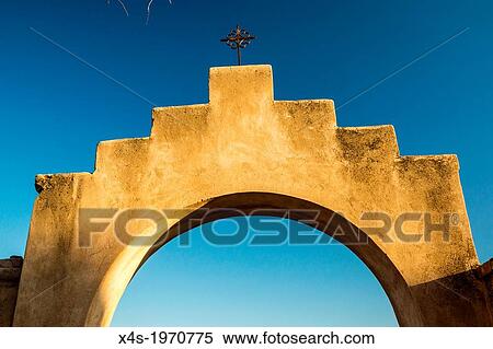 An iconinc adobe arhway and crucifix at a Spanish mission in Arizona. View Large Photo Image Stock Photography - An iconinc adobe arhway and crucifix at a Spanish mission in Arizona.. Fotosearch