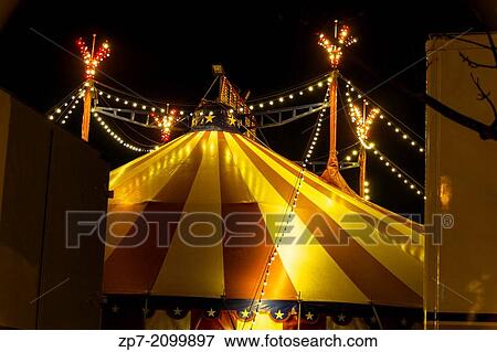 An illuminated big top at night with the nigh sky at background. View Large Photo Image Stock Photo - An illuminated big top at night with the nigh sky at background.. Fotosearch