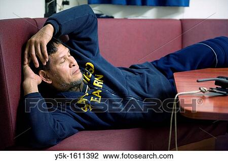 Stock Image - An Indonesian seaman or sailor on the container-vessel MV Flintercape, during a journey from Rotterdam, Netherlands, to Sundsvall, Sweden.. Fotosearch