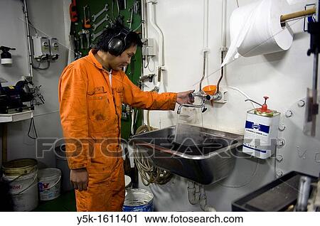 An Indonesian seaman or sailor on the container-vessel MV Flintercape, during a journey from Rotterdam, Netherlands, to Sundsvall, Sweden. View Large Photo Image Stock Image - An Indonesian seaman or sailor on the container-vessel MV Flintercape, during a journey from Rotterdam, Netherlands, to Sundsvall, Sweden.. Fotosearch