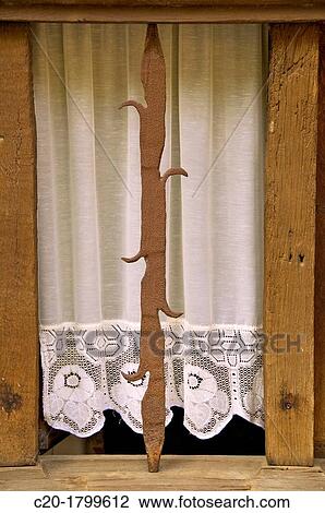 An interesting old window with lace curtain, and iron work, Dinan, Brittany, cotes d? Armor, France View Large Photo Image Stock Image - An interesting old window with lace curtain, and iron work, Dinan, Brittany, cotes d? Armor, France. Fotosearch