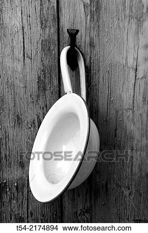 An old chamber pot on a hook View Large Photo Image Picture - An old chamber pot on a hook. Fotosearch