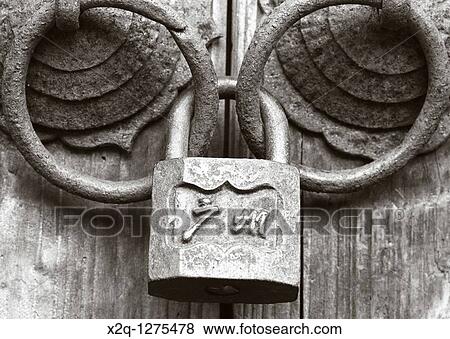 An old lock holds ancient door handles at Changlong View Large Photo Image Stock Photo - An old lock holds ancient door handles at Changlong. Fotosearch
