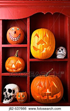 An old red cabinet with Halloween items, carved pumpkins, skulls View Large Photo Image Stock Photograph - An old red cabinet with Halloween items, carved pumpkins, skulls. Fotosearch