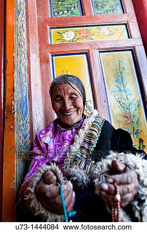 Picture - An old Tibetan pilgrim visiting Labrang monastery during the TIbetan new year. Fotosearch