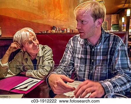 An older woman exemplifies the? cougar,? a woman who favors a much younger man in a Brooklyn, New York, restaurant MODEL RELEASE View Large Photo Image Stock Image - An older woman exemplifies the? cougar,? a woman who favors a much younger man in a Brooklyn, New York, restaurant MODEL RELEASE. Fotosearch