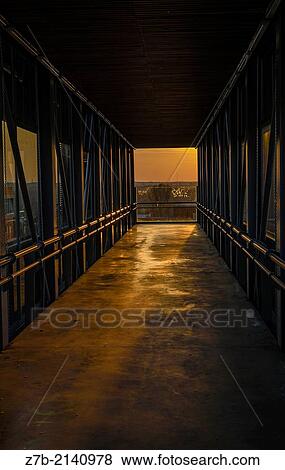 Stock Photo - An open air tunnel in the Complutense university, Madrid city, Spain.. Fotosearch