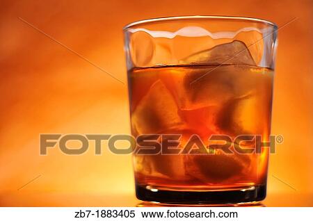 An orange colored back-lite adult beverage View Large Photo Image Stock Photography - An orange colored back-lite adult beverage. Fotosearch