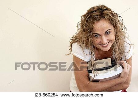 An student woman smiling View Large Photo Image Picture - An student woman smiling. Fotosearch