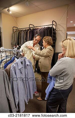An unemployed Hispanic man proudly gets new business clothing from Working Wardrobes, View Large Photo Image Stock Photo - An unemployed Hispanic man proudly gets new business clothing from Working Wardrobes,. Fotosearch