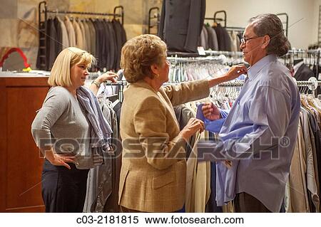 An unemployed Hispanic man proudly gets new business clothing from Working Wardrobes, View Large Photo Image Stock Photography - An unemployed Hispanic man proudly gets new business clothing from Working Wardrobes,. Fotosearch