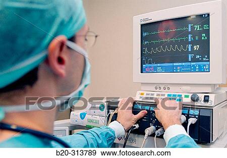 Anaesthetist at laparoscopy operating room of hospital View Large Photo Image Stock Photo - Anaesthetist at laparoscopy operating room of hospital. Fotosearch