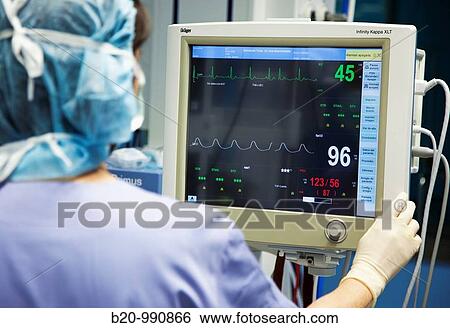 Stock Photograph - Anaesthetist monitoring vital signs, prostate surgery, urology. Hospital Policlinica Gipuzkoa, San Sebastian, Donostia, Euskadi, Spain. Fotosearch